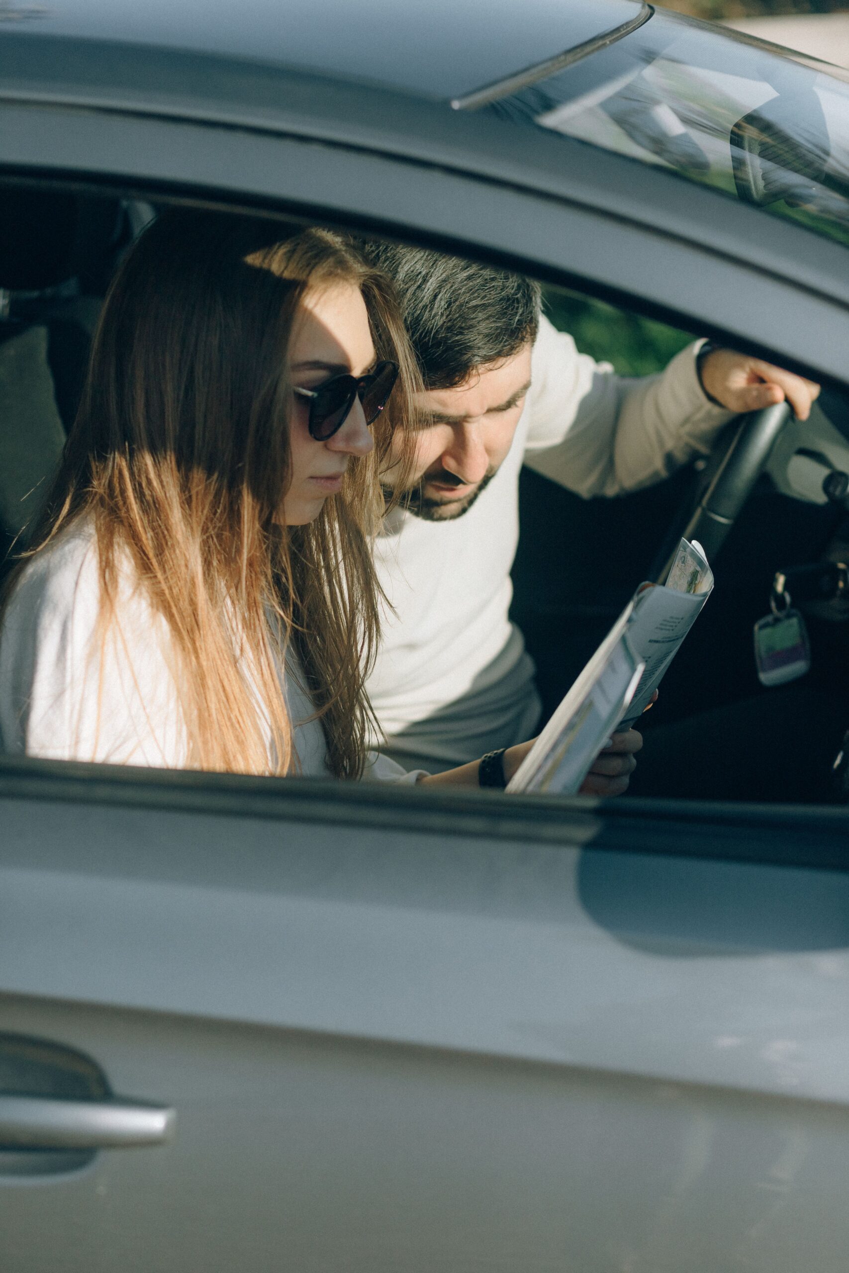 Instructor guiding learner during practical driving training